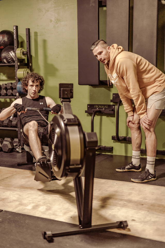 Head coach Matt Titus demonstrates the finer points of the rope climb for a SoWal CrossFit® personal training client.